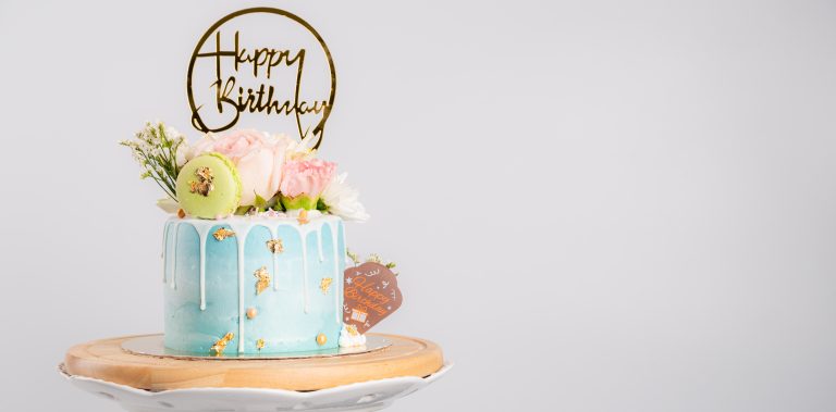 happy-birthday-cake-with-macaroons-flowers-stand